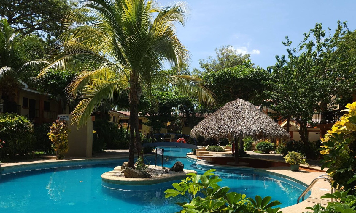 Coco Condo | Amazing Pool, Tropical Gardens, Walking Distance to the Beach