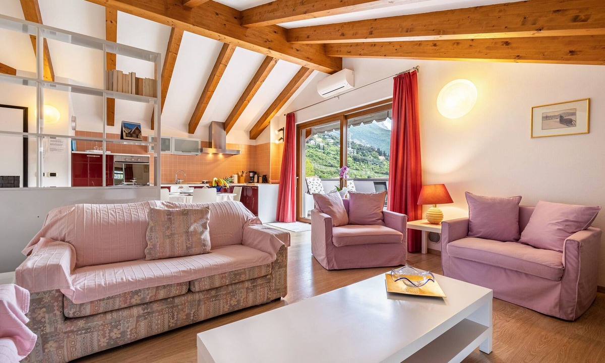 Torbole sul Garda Apartment | Apartment 'Attic Rosa with Private Terrace' with Mountain View, Wi-Fi and Air Conditioning