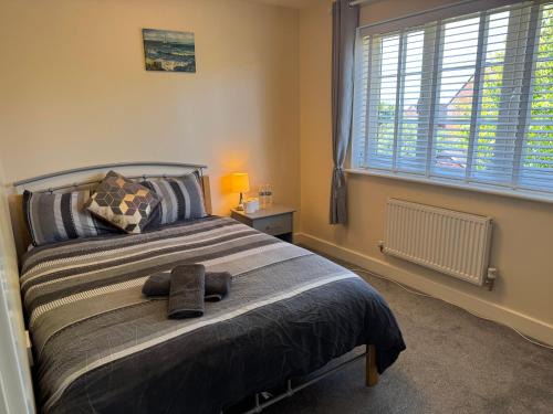 Milton Malsor House | Double bedroom in a residential home with parking