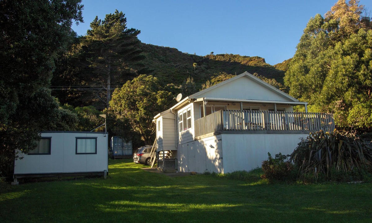 Cape Palliser House | Family friendly bach – relax on the deck and soak in the ocean views