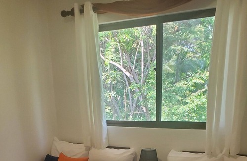 Coco Condo | Amazing Pool, Tropical Gardens, Walking Distance to the Beach
