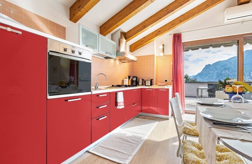 Torbole sul Garda Apartment | Apartment 'Attic Rosa with Private Terrace' with Mountain View, Wi-Fi and Air Conditioning