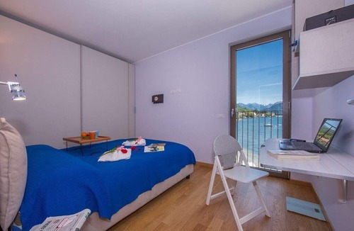 San Siro Apartment | Apartment in a lakeside complex. Swimming pool, private dock, covered garage