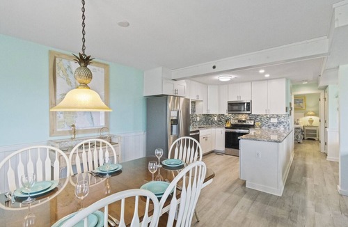 Duck Condo | Bright & beachy updated unit with ocean views from covered furnished deck!