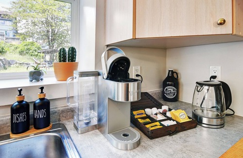Heritage Downtown House | Cozy 1-BR suite with ocean views, full kitchen, projector, and garden