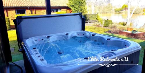 Tattershall House | Elite Retreats 4U Lakeside Hot Tub Log Cabin with the fishing peg at Tattershall Lakes Park