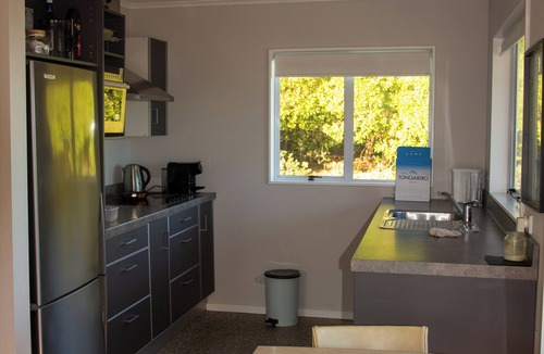 Cape Palliser House | Family friendly bach – relax on the deck and soak in the ocean views