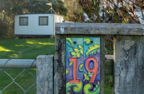 Cape Palliser House | Family friendly bach – relax on the deck and soak in the ocean views