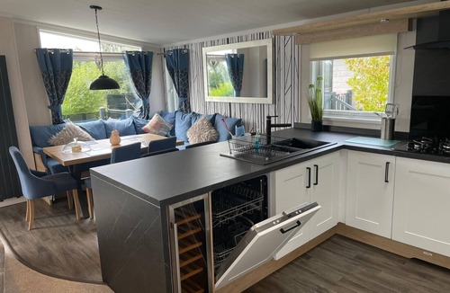 Dogdyke Cabin | Indulgence Lakeside Lodge i3 is prime location with a private fishing peg and sunken hot tub