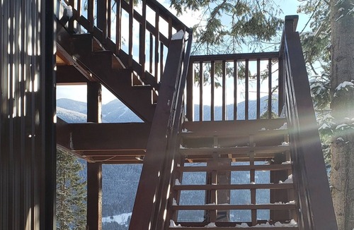Central Kootenay House | Lake view boho inspired home with heated covered parking