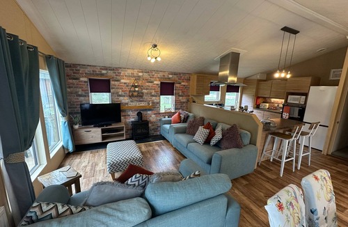 Tattershall Cabin | luxury lakeside lodge with a sunken hot tub on bull rush a peaceful feature lake @Tattershall lakes