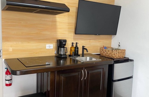 Armenia Apartment | Pool Deck Studio Suite | Modern Stay in Belmopan