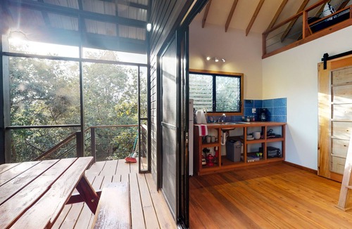 Surfside Cabin | Quiet treehouse cabana with veranda, hammock, WiFi & partial AC - walk to beach