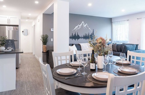 Revelstoke Condo | Spacious and comfortable modern mountain getaway, large patio with BBQ, pet-friendly and plenty of storage for bikes and skis.