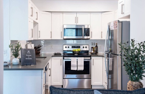 Revelstoke Condo | Spacious and comfortable modern mountain getaway, large patio with BBQ, pet-friendly and plenty of storage for bikes and skis.