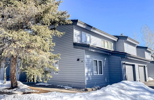 Edwards House | Sunny two-story townhouse with fireplace plus pool, hot tub, sports courts