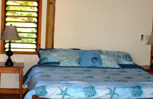 Palmetto Bay House | Tranquil Beachfront Bungalow In Private, Gated, Eco-Dive Resort Community.