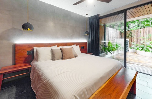 Zama Condo | Tranquil condo with a pool, fitness center, central AC, & patio