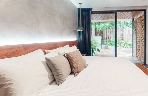 Zama Condo | Tranquil condo with a pool, fitness center, central AC, & patio