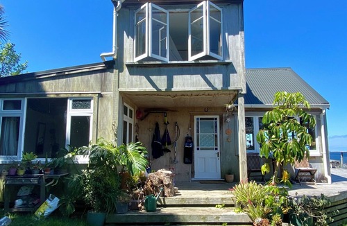 Tryphena House | Tryphena sunset and sea views! 5 minute walk to beaches, shops and restaurants.