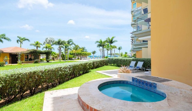 Beachfront - Garden Delight 3BR condo - E125