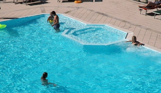 Bright and modern apartments with pool and beach and luxurious villas on the S