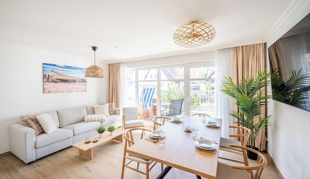 Bright vacation apartment in prime location, own beach chair on the beach, sauna in the house