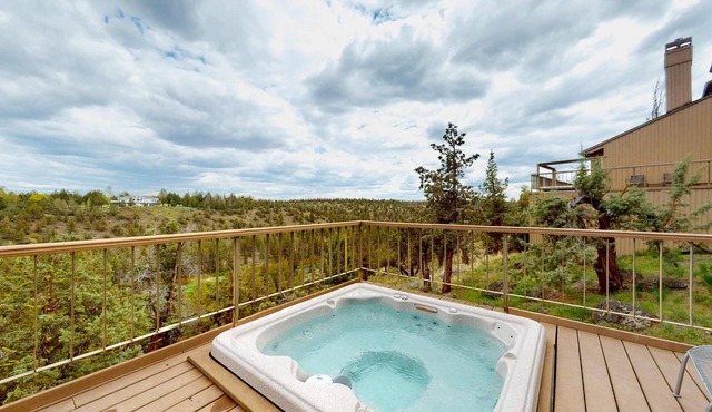 Charming waterfront condo with pool, tennis, hot tub, balcony, & W&D
