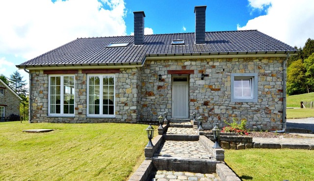 Detached natural stone house with sunny garden and terrace, modern interior