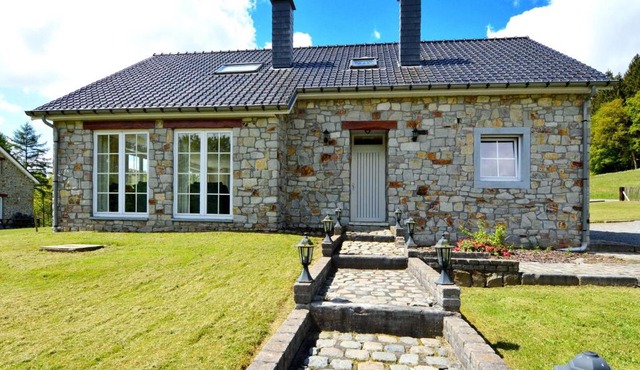 Detached natural stone house with sunny garden and terrace modern interior