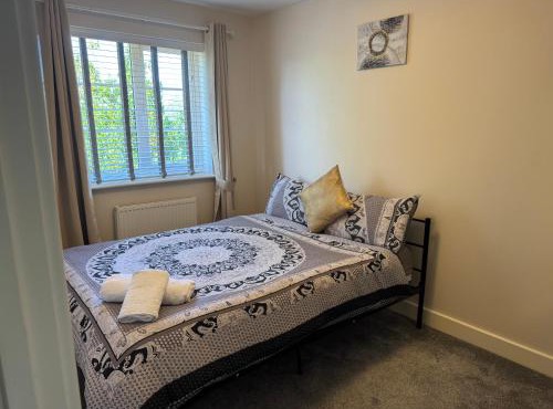 Double bedroom in a residential home with parking
