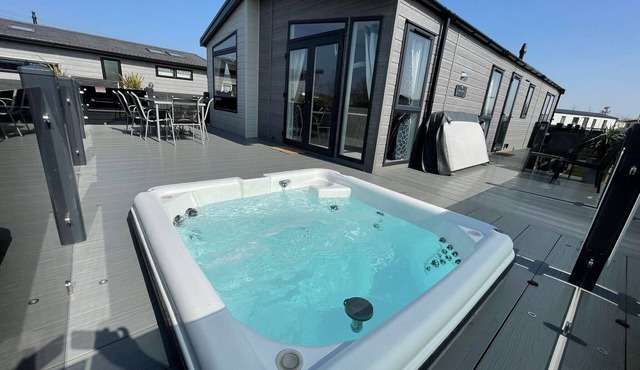 Indulgence Lakeside Lodge i3 is prime location with a private fishing peg and sunken hot tub