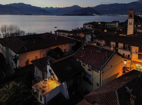 Romantic Attic Retreat with Panoramic Terrace, Steps from the Lake
