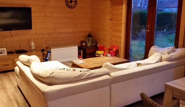 Room for rent in a wooden house.