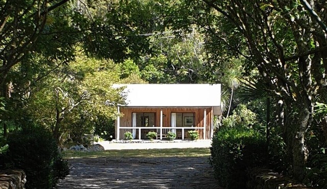 Rustic cabin & large kitchen block nestled in a native garden.