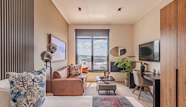 Serene Studio Apt w free WiFi, air-con, kitchen, work desk, TV, sofa & wardrobe.