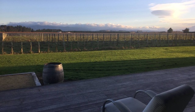 Stunning views of the Tararuas and adjacent vineyard