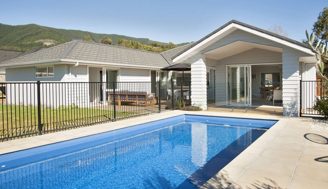 Sunny & spacious modern home with heated swimming pool.