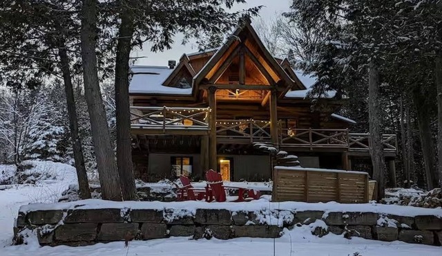 Waterfront Log Cottage with Hot Tub and Sauna