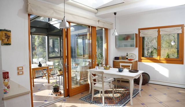 Wonderful living in villa in the garden. View of mountains, lake, many attractions.